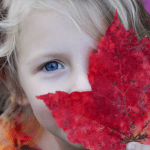 Red Wigglers and Kids young girl looking at a leaf.