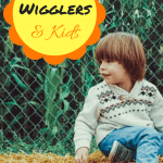 Red Wigglers and Kids Straw Kid sitting on straw by a cornfield